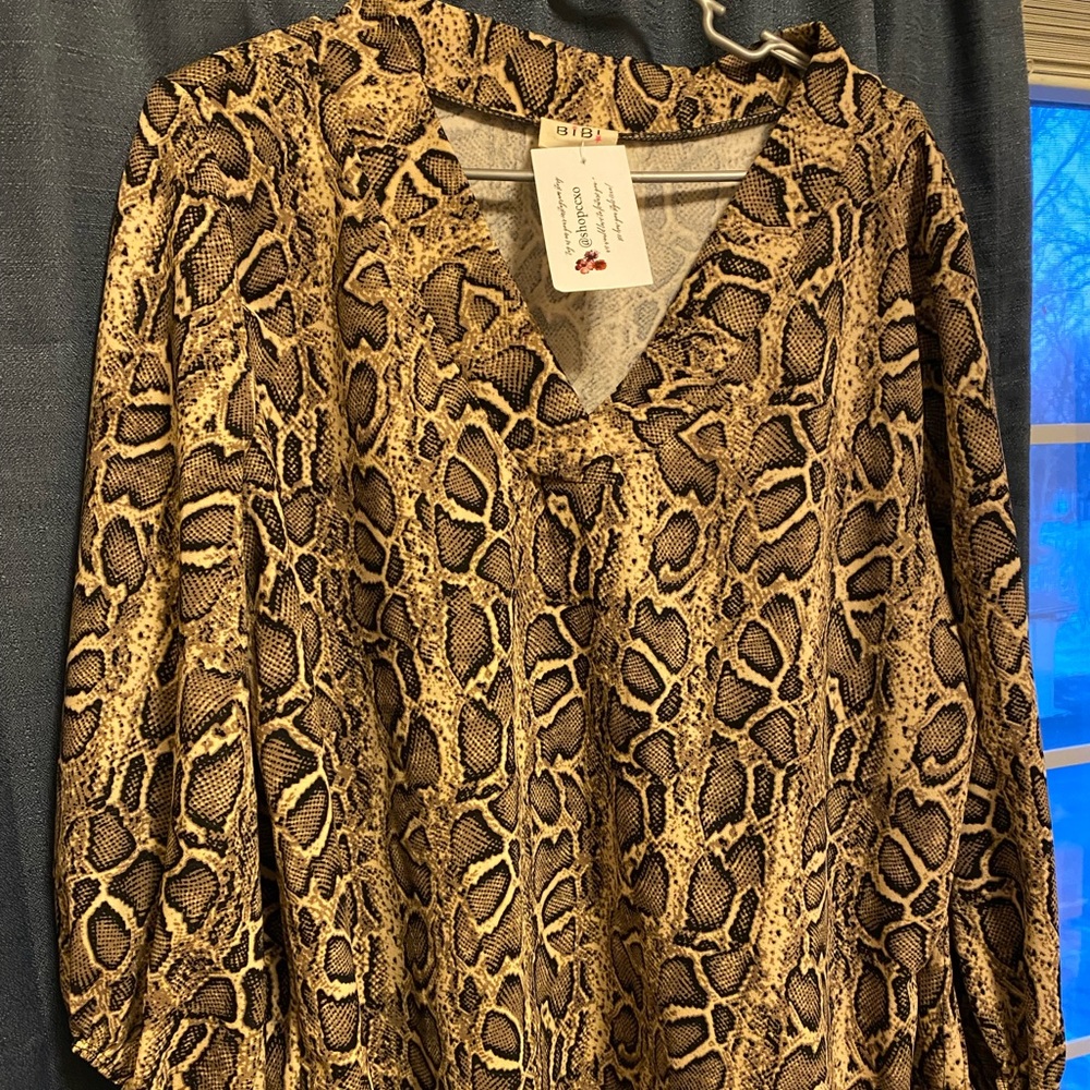 Snakeskin top with bell sleeves